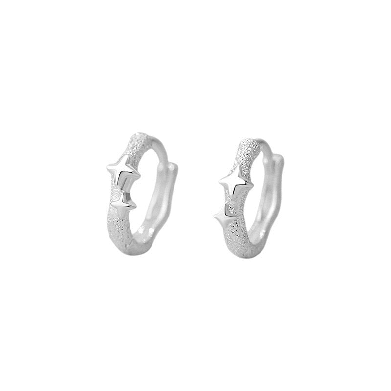 Four pointed stars frosted huggie earrings