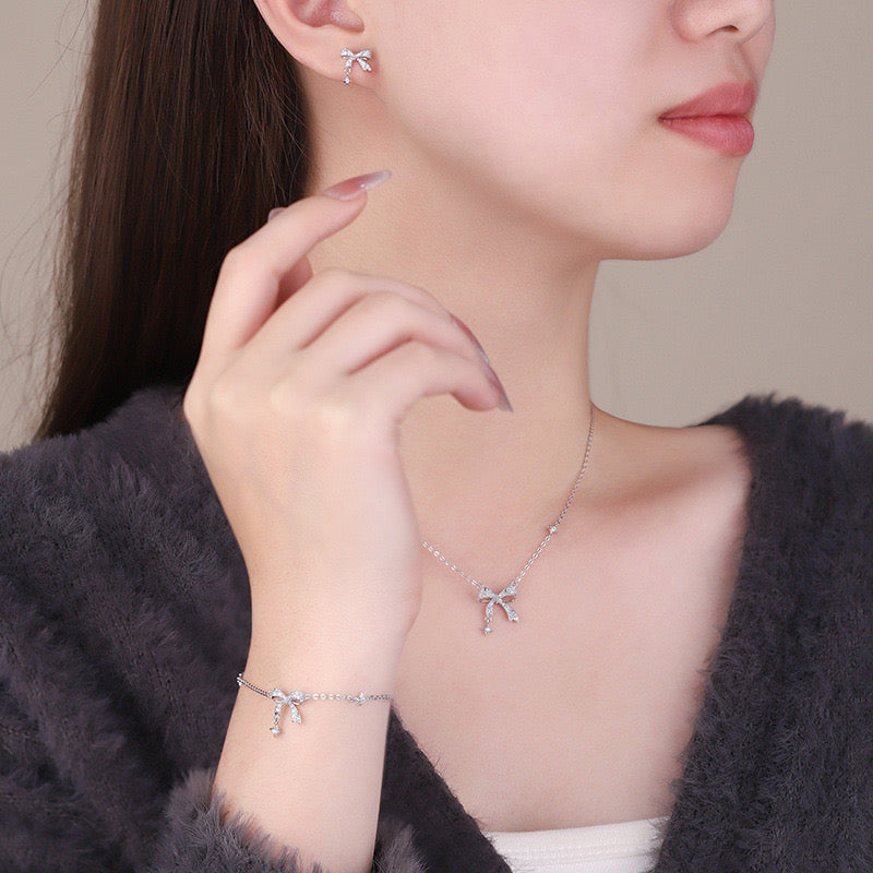 Shimmering Bow Drop Stud Earrings